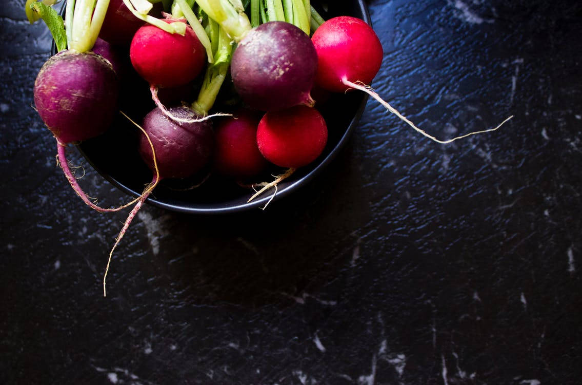 Fresh Radishes In A Rustic Bowl: A Celebration Of Healthy Eating