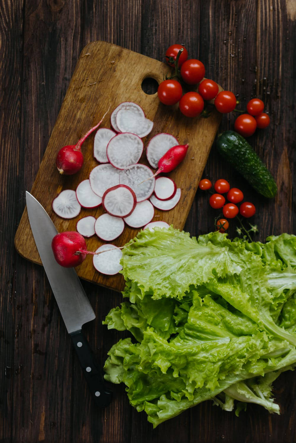 Fresh Red Radish Nestled Among Crisp Lettuce Leaves Background