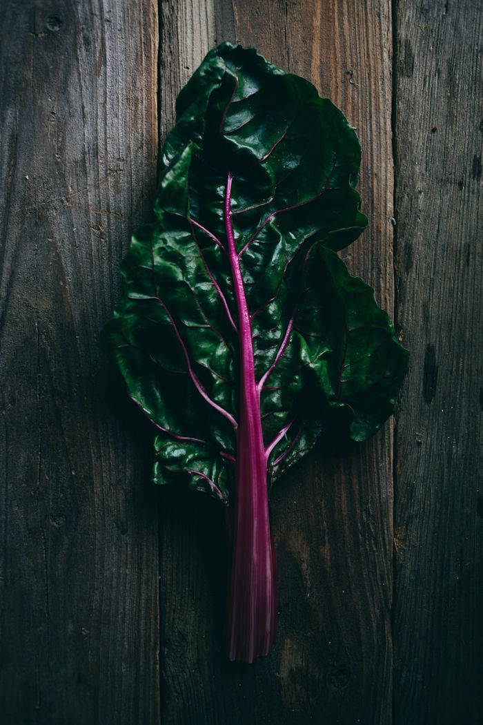 Fresh Swiss Chard On Rustic Wooden Table Background