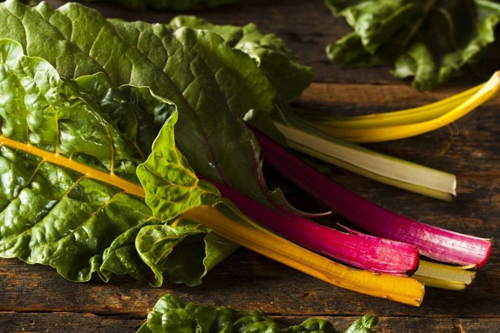 Fresh Swiss Chard On Rustic Wooden Table Background