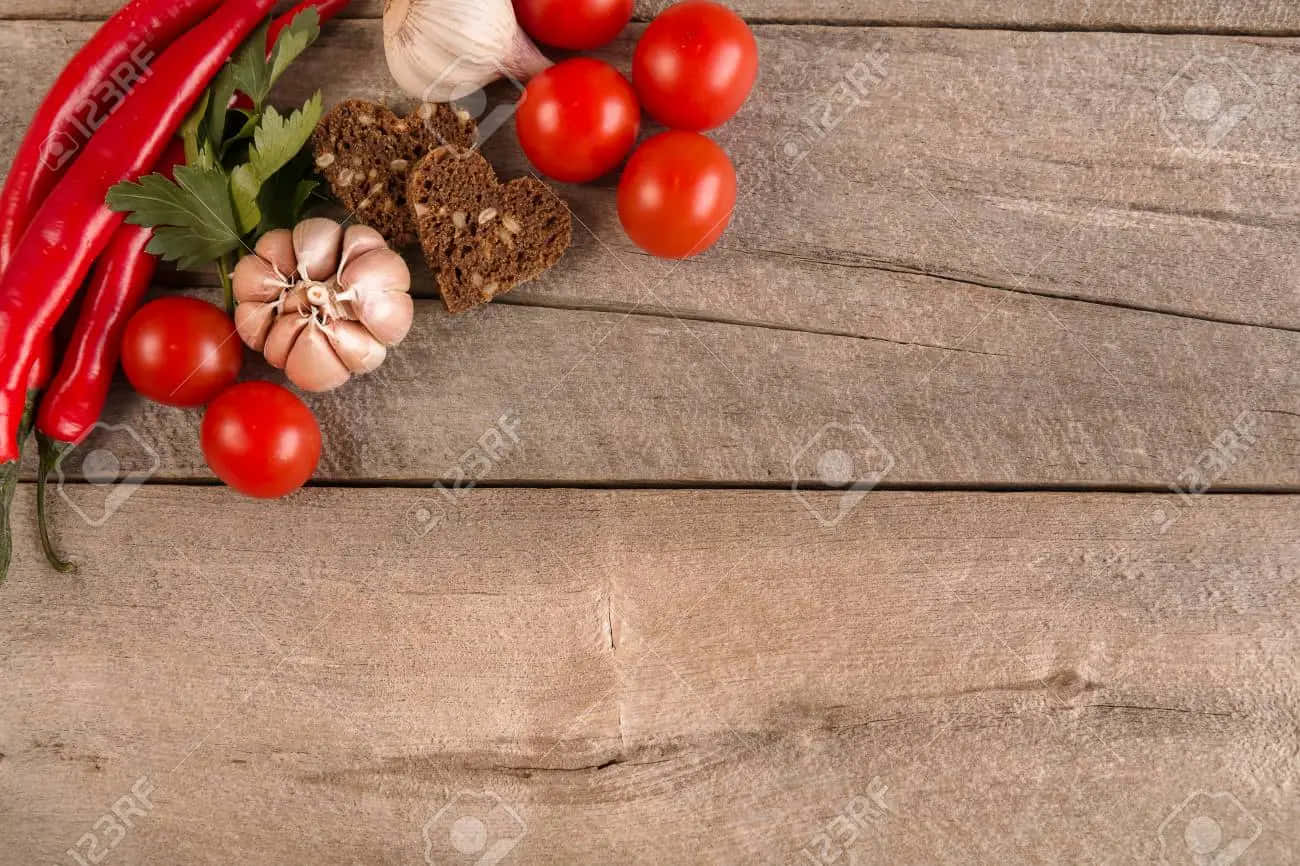 Fresh Tomatoes, Garlic, Chili Peppers And Herbs On A Wooden Background Background