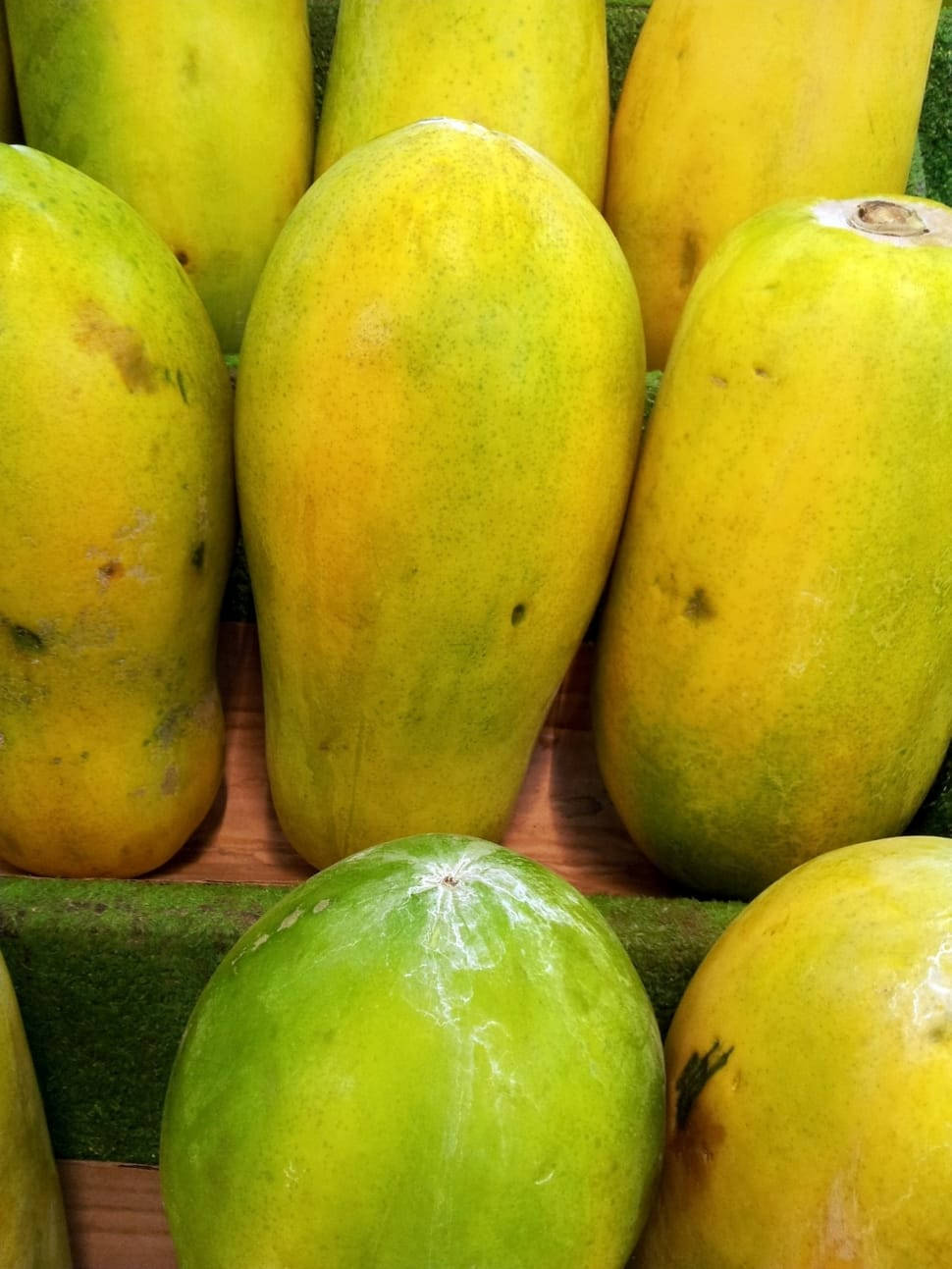 Fresh Vibrant Papayas Displayed On A Market Shelf. Background