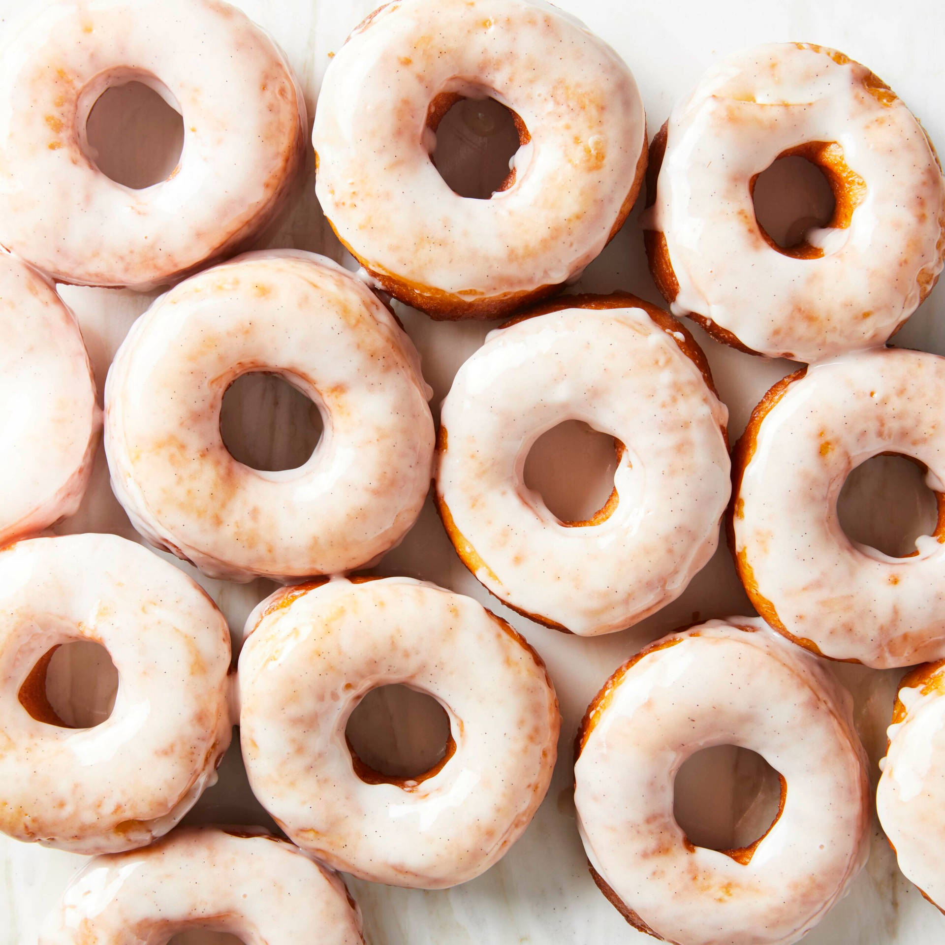 Fresh White-glazed Donuts Background