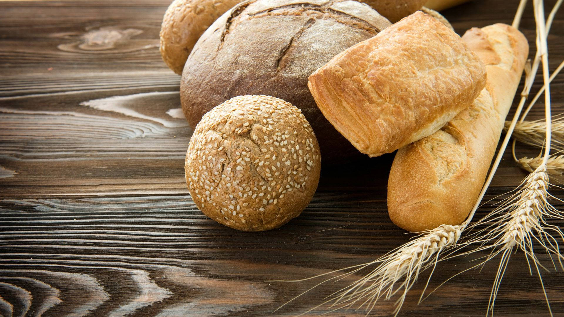 Freshly Baked Artisan Bread With Wheat Background