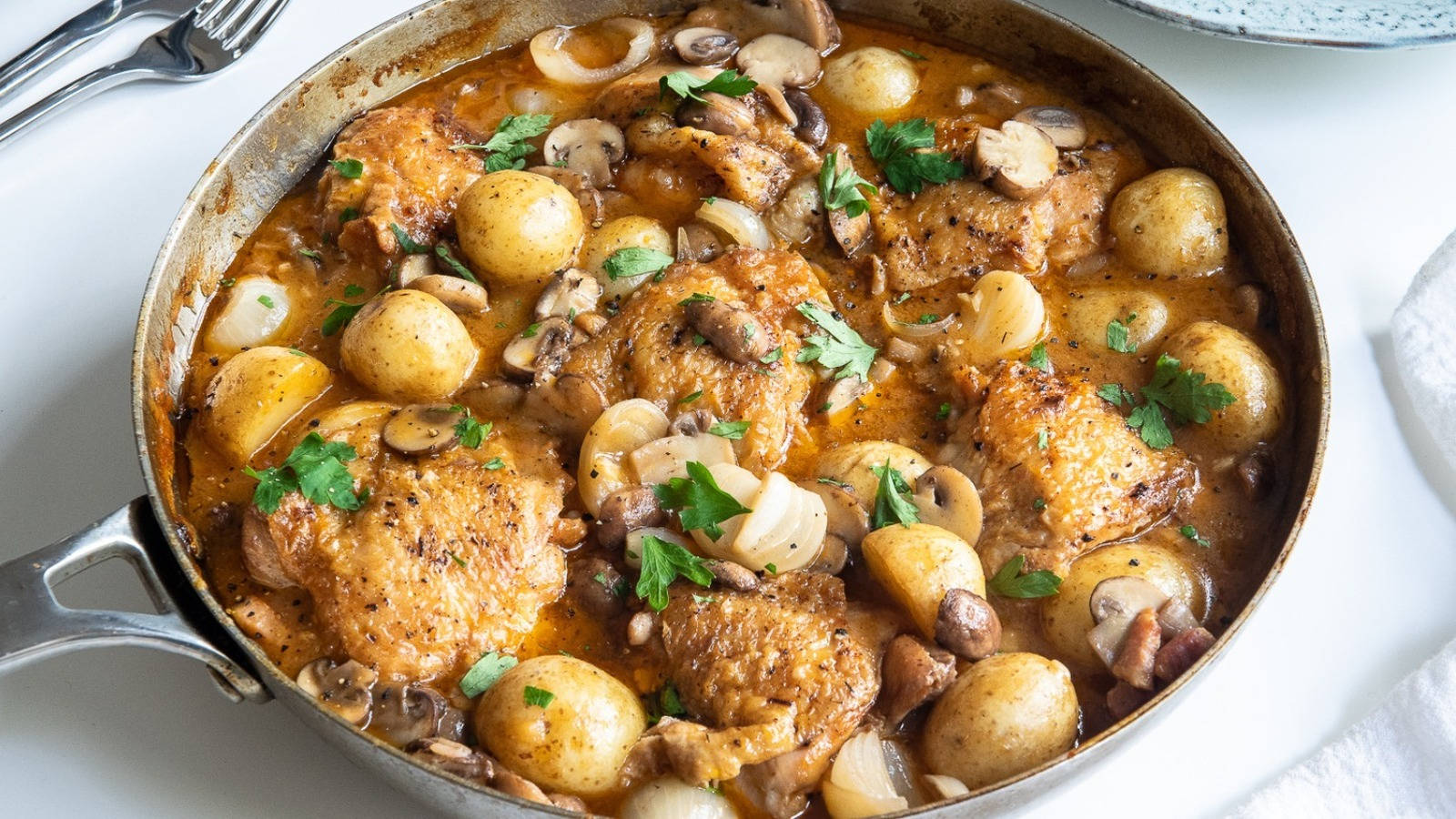 Freshly Cooked Coq Au Vin In An Aluminum Pan Background