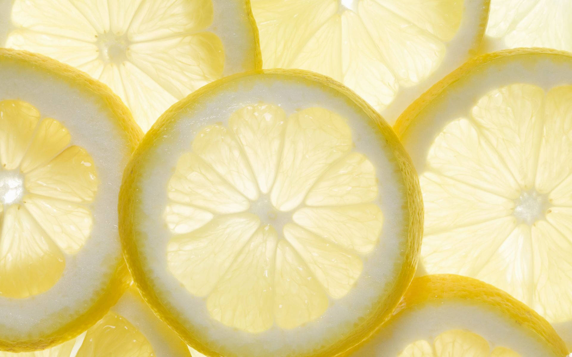 Freshly Harvested Lemons Soaking In Crisp, Cool Water. Background