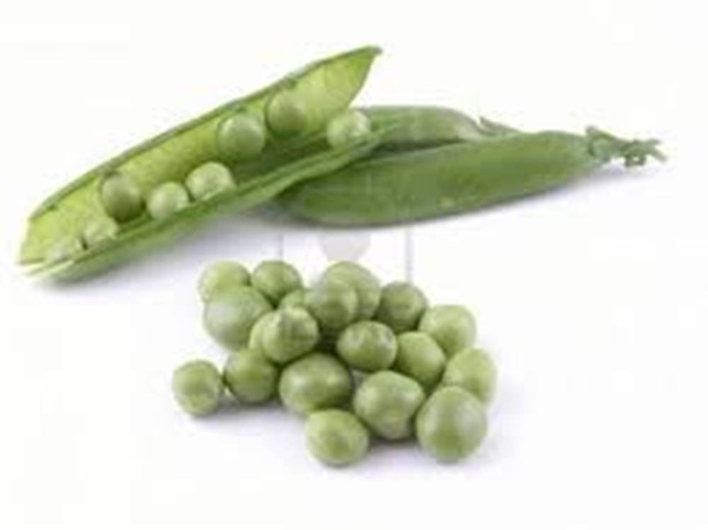 Freshly Picked Sugar Snap Peas On A Wooden Surface. Background