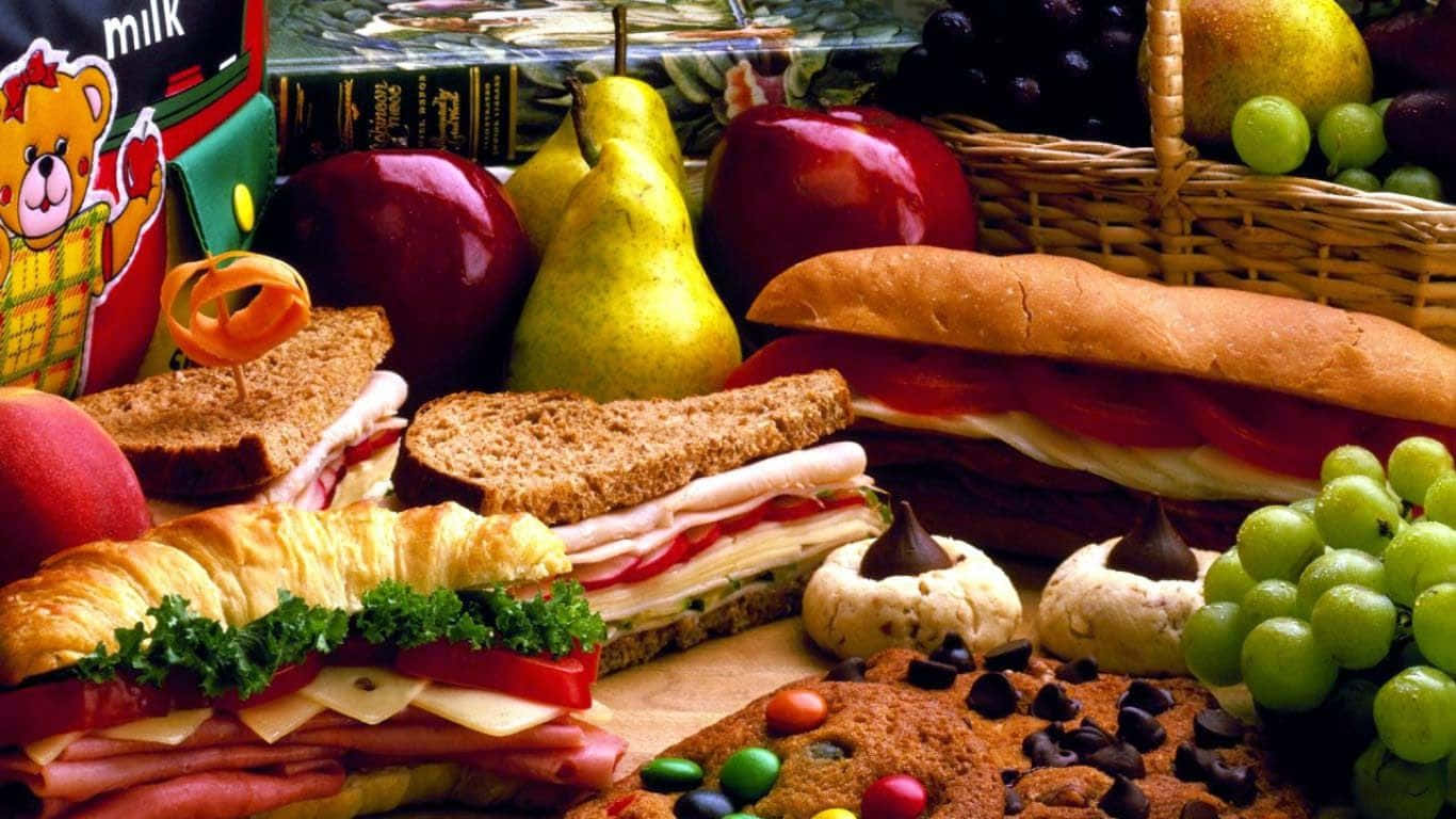 Freshly Prepared Delicious Sandwiches Paired With Refreshing Fruits And Tantalizing Cookies Background