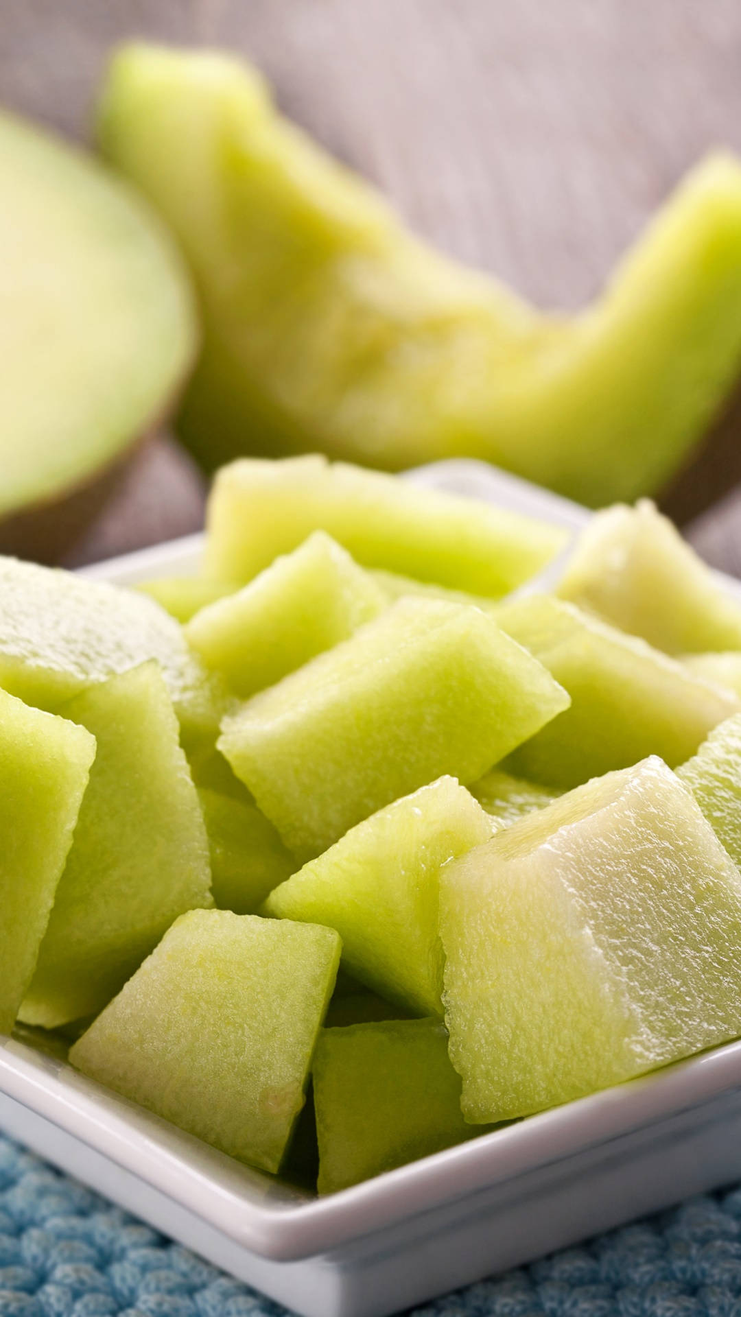 Freshly Sliced Honeydew Melon Served On A Plate Background