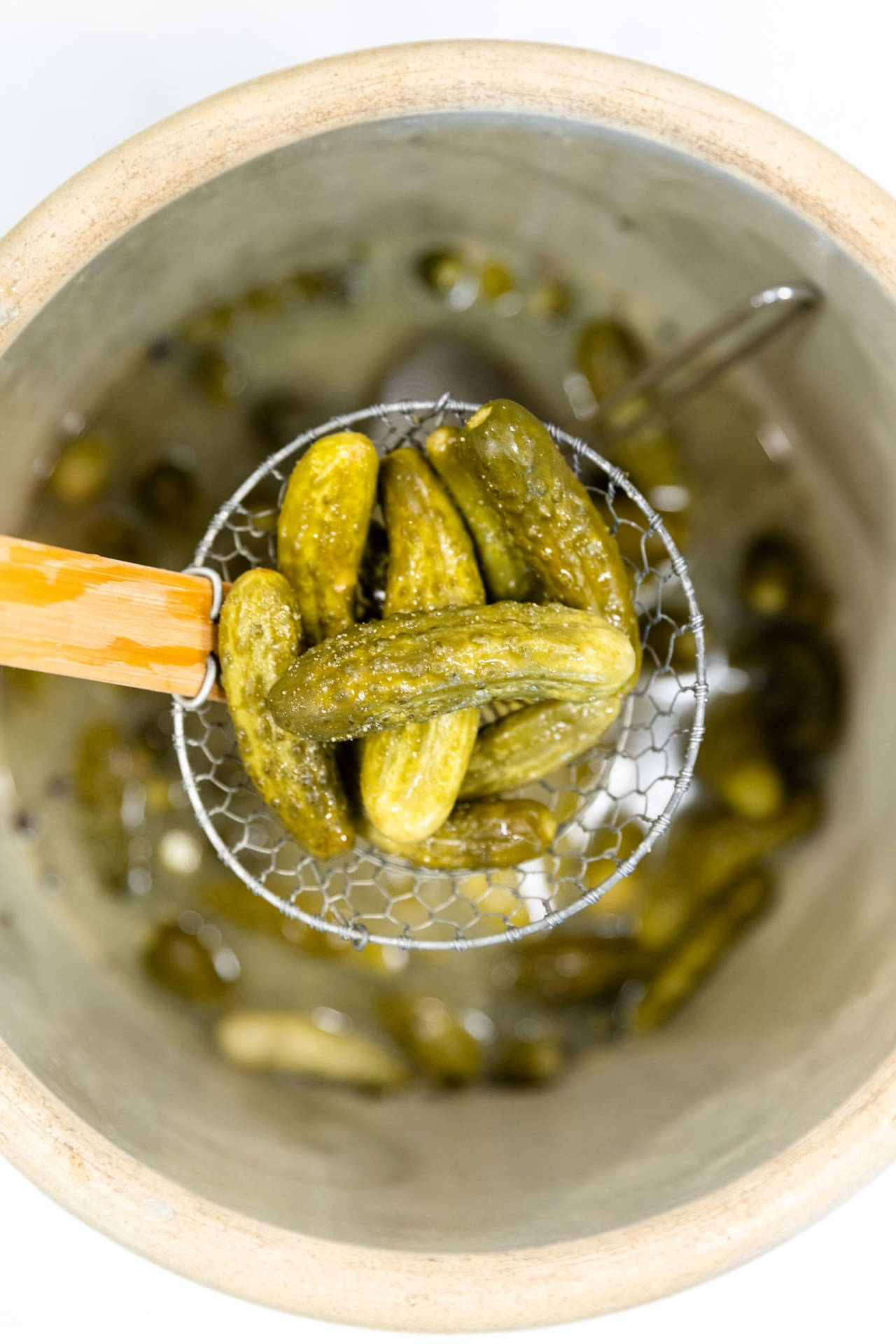 Freshly Washed Pickles In A Strainer Background