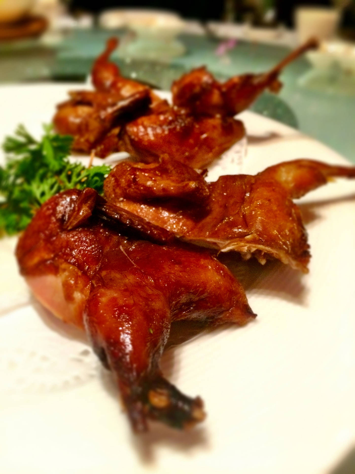 Fried Quail Legs On A Plate Background