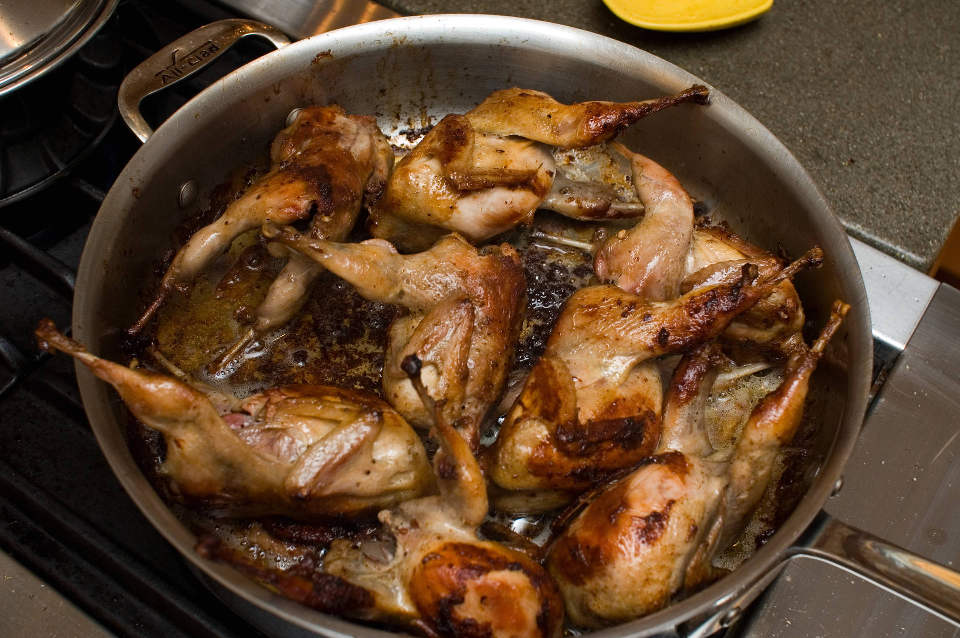 Fried Quails In A Casserole Background