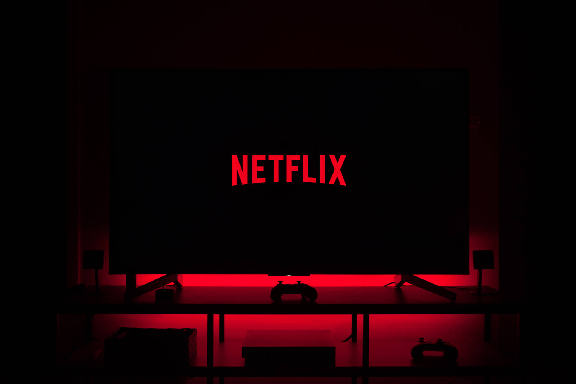 Friends Enjoying A Netflix Movie Night Background