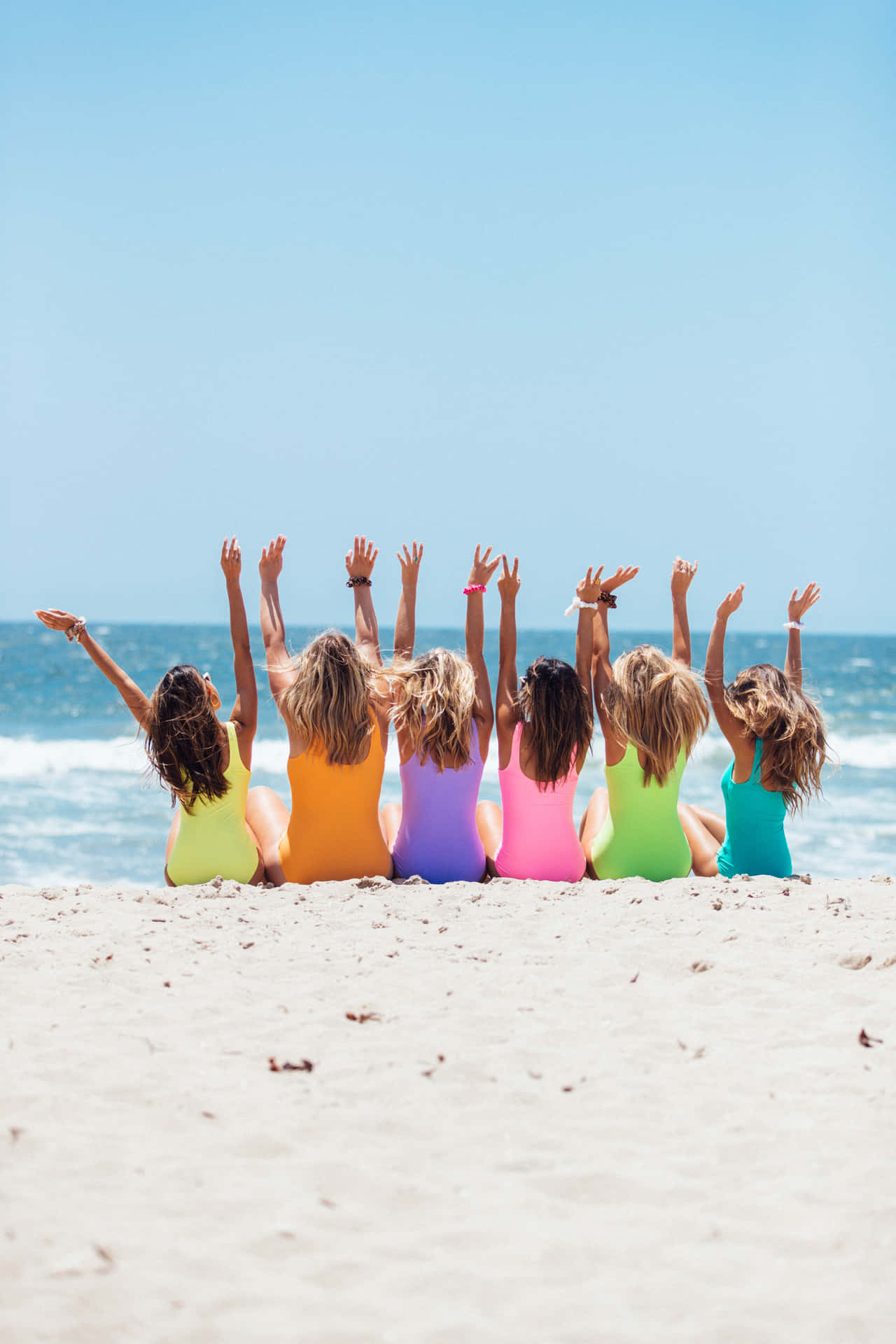 Friends Having Fun At The Beach In Summer