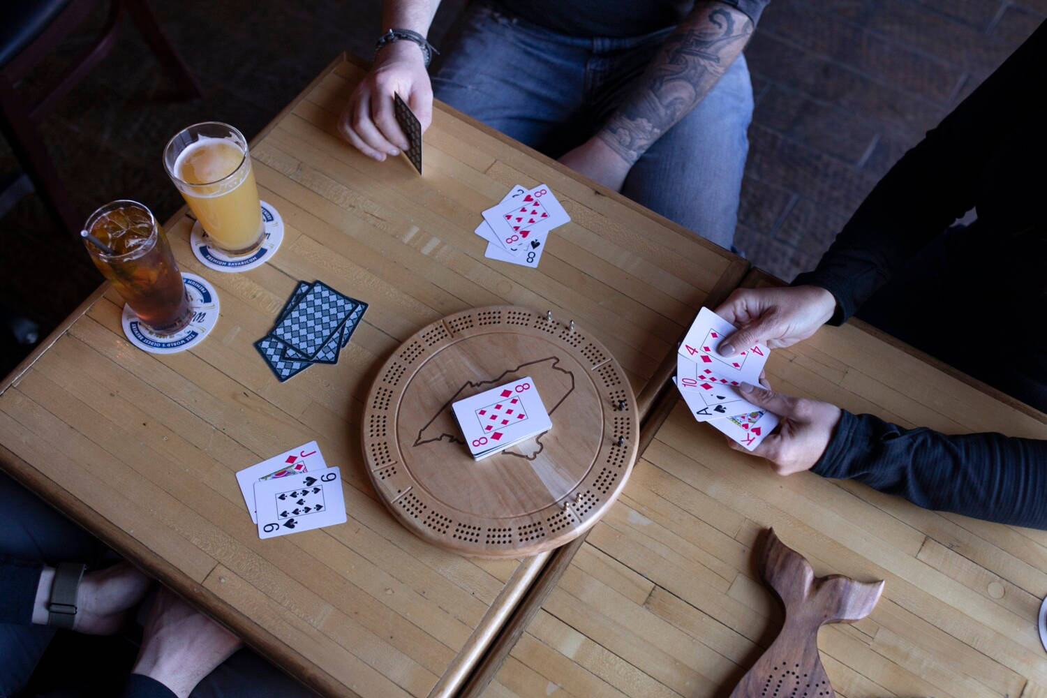 Friends Playing Card Game Cribbage