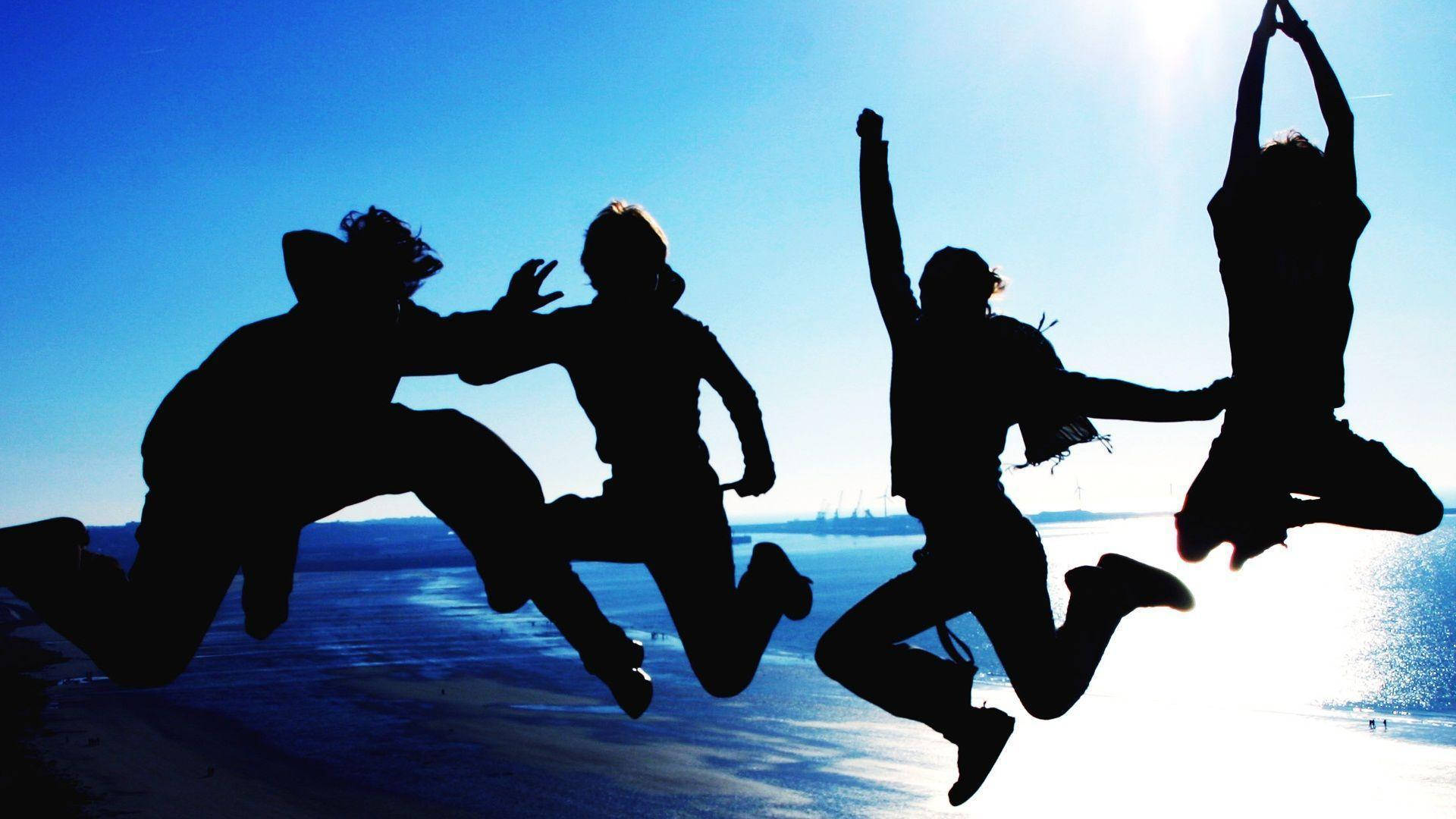 Friendship Jumping In Midair Background