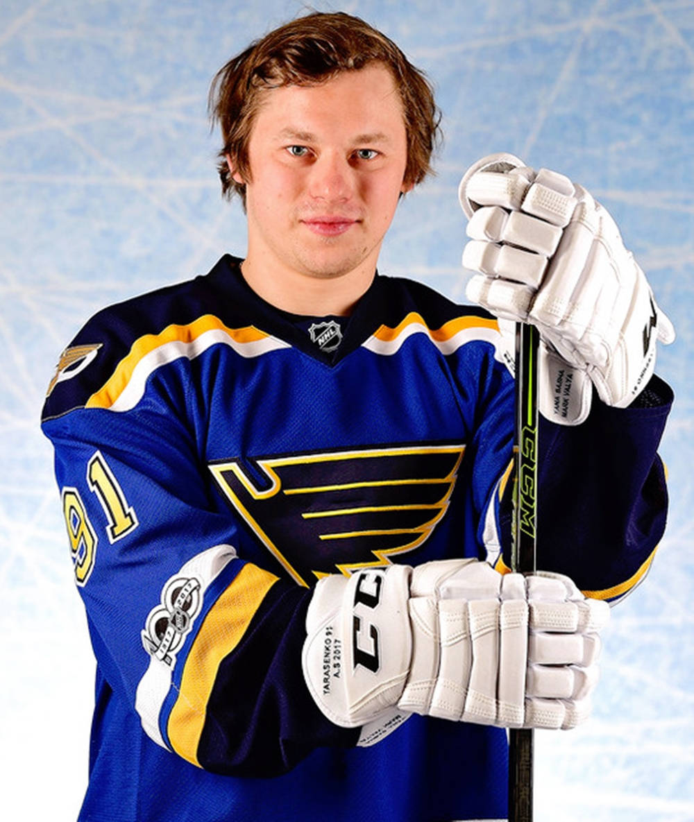 Front Portrait Of Vladimir Tarasenko Smirking While Holding Hockey Stick