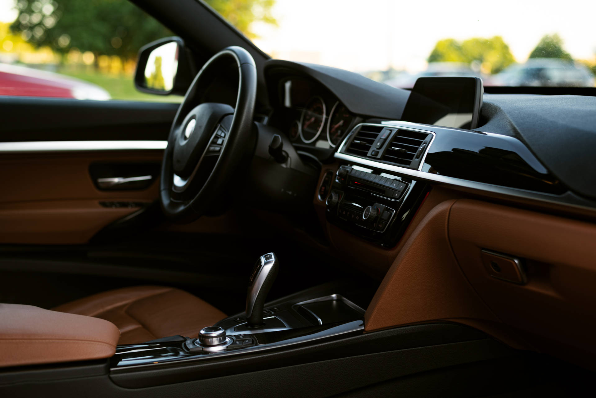 Front Seat Inside A Black Bmw Background