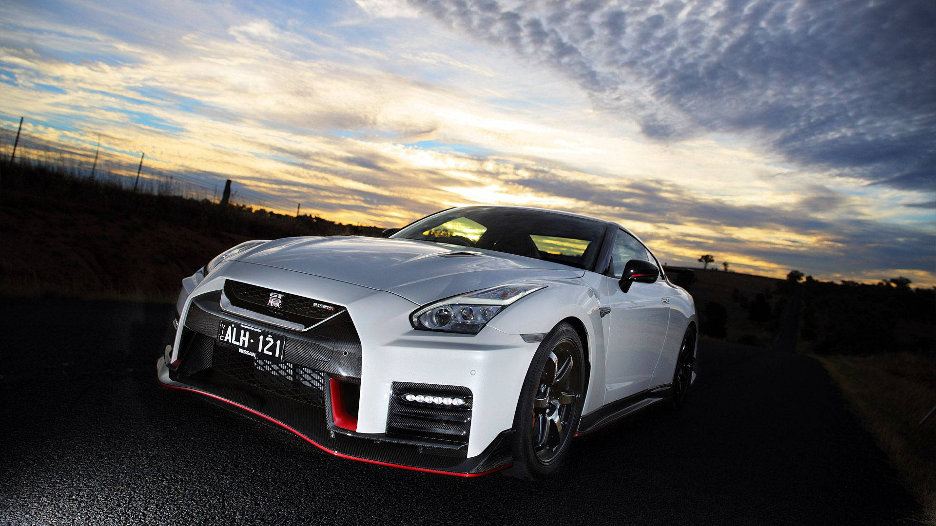 Front View Of A White Nissan Gtr Car Background