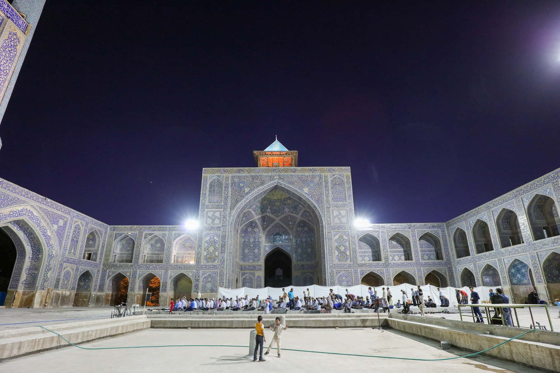 Front View Of Shah Mosque At Night Background
