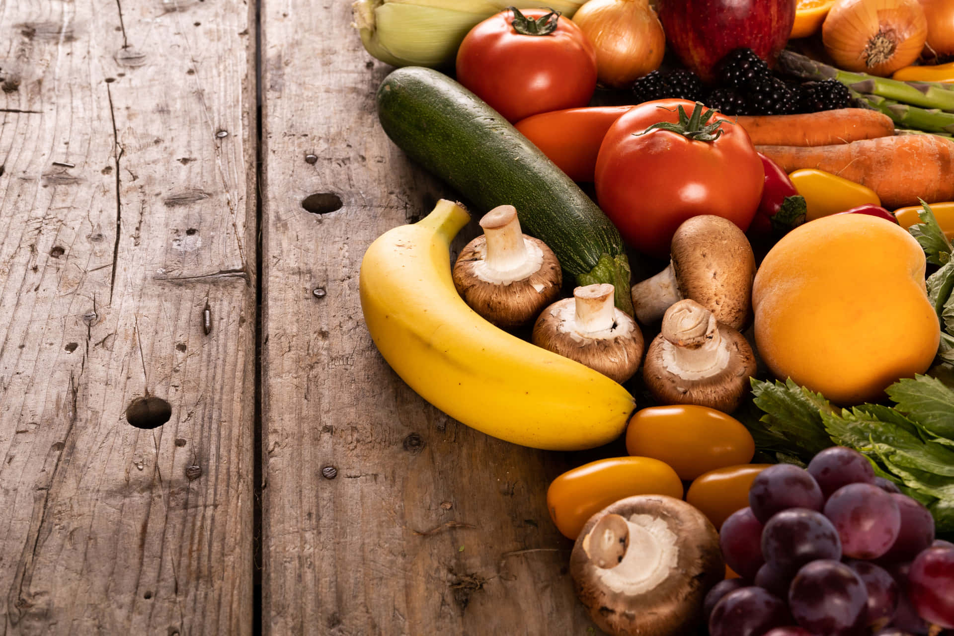 Fruits And Vegetables On A Wooden Surface Background