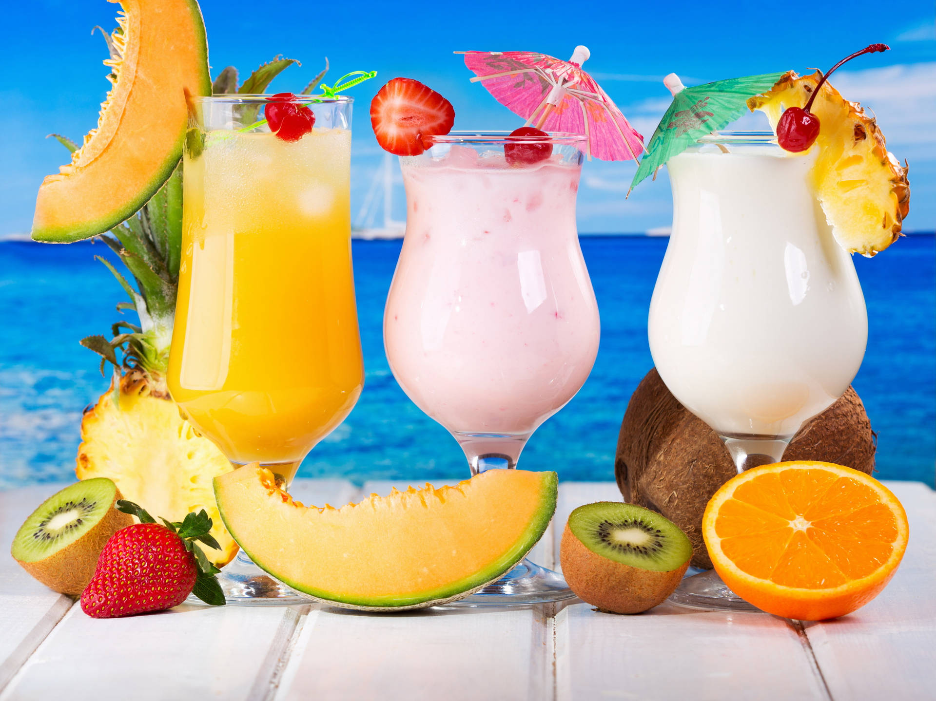 Fruity Glasses Of Tropical Drinks Background