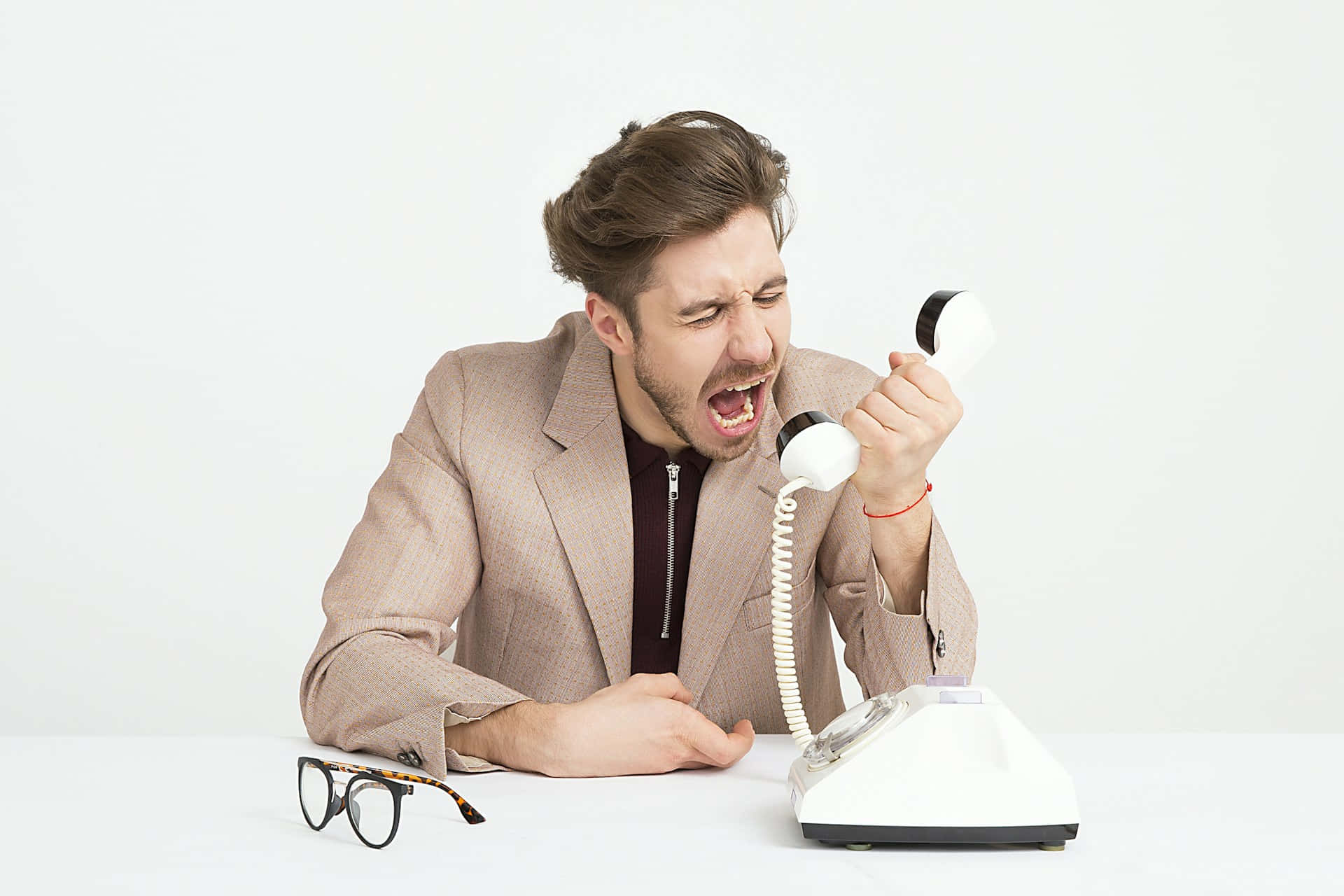 Frustrated Man Yelling Into Phone