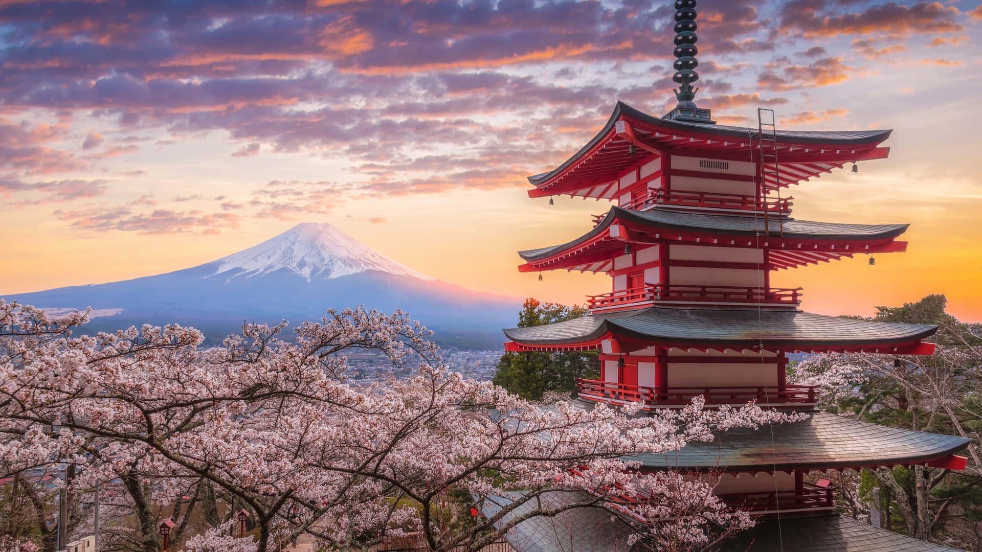 Fuji Peak With Chureito Pagoda And Cherry Blossoms Background