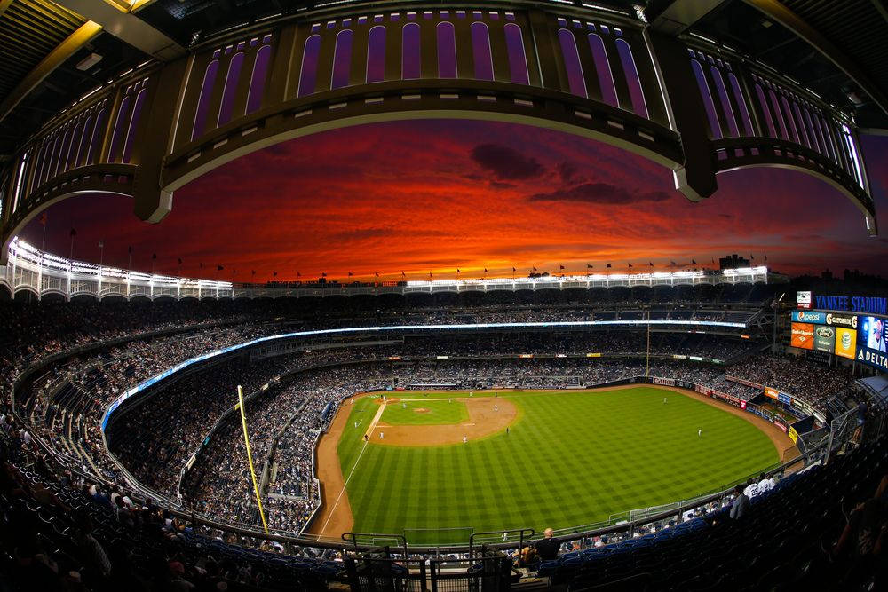 Full House Yankee Stadium At Dusk Background