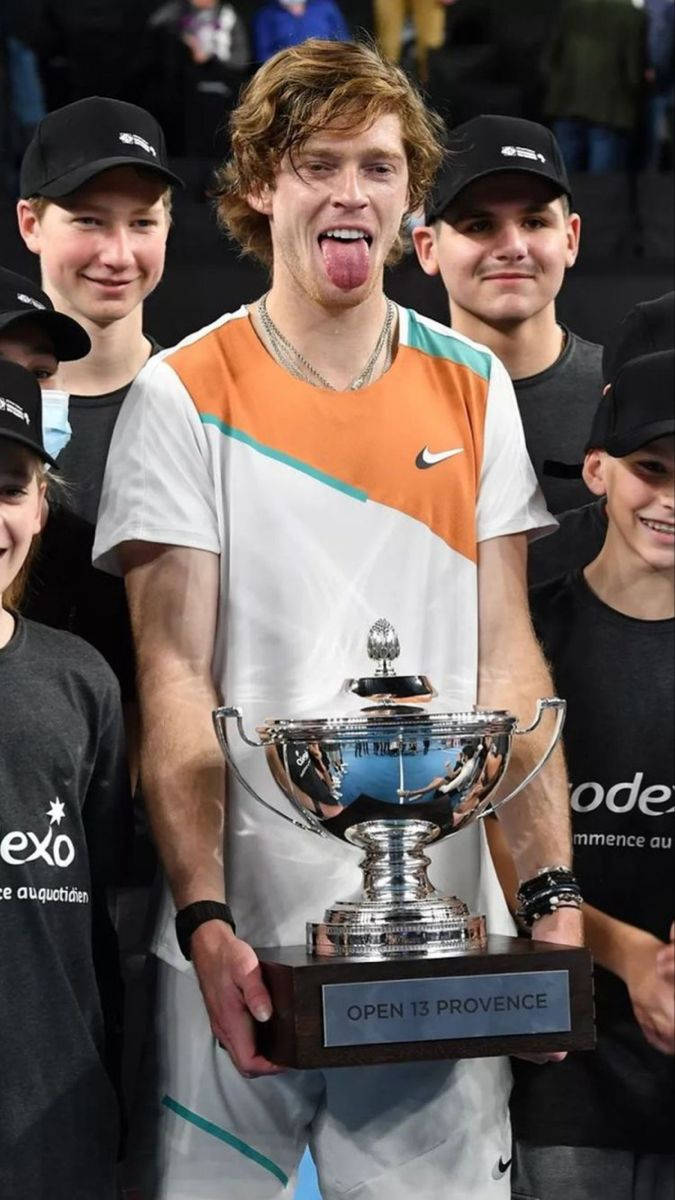 Funny Andrey Rublev With Trophy Background