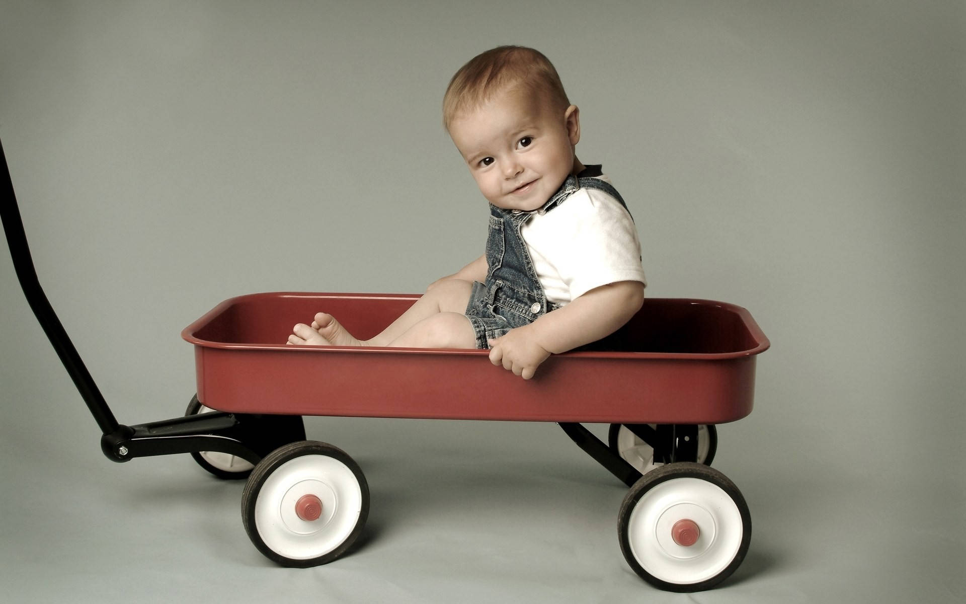 Funny Baby On A Wagon