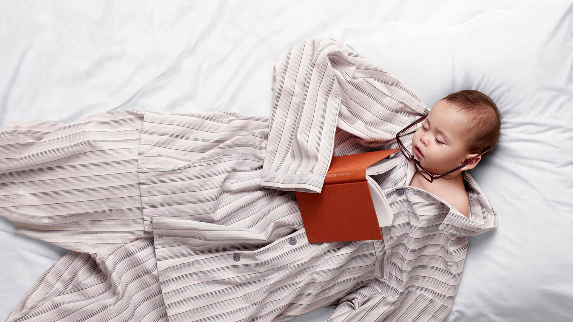 Funny Baby Sleeps In Big Pajamas Background