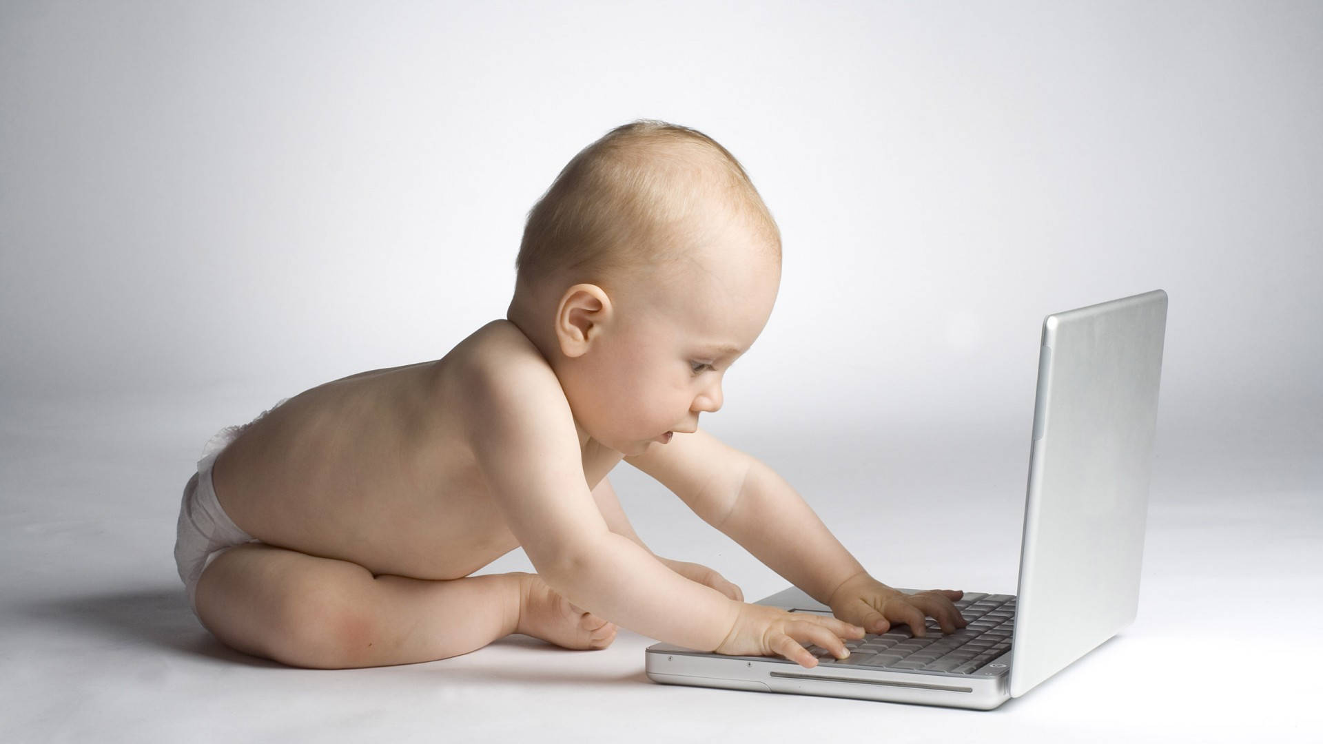 Funny Baby With A Laptop Background