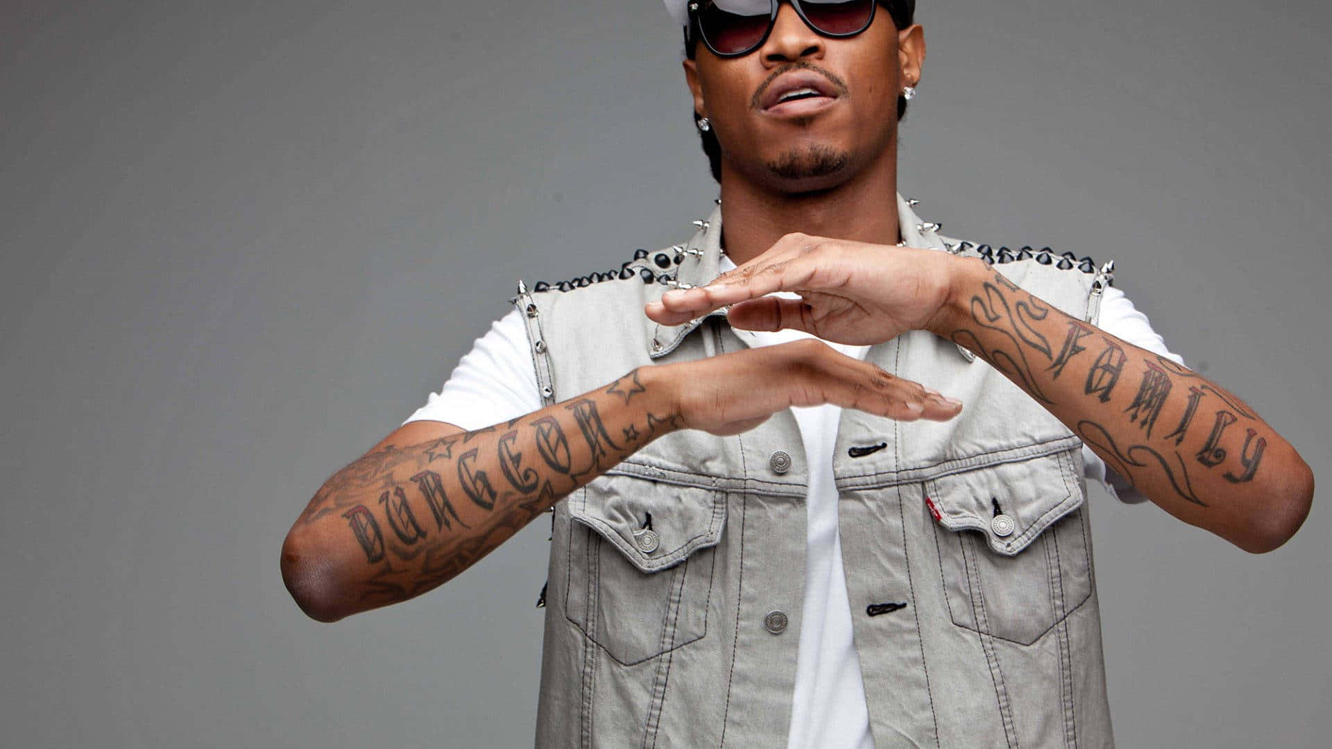 Future Rapper Pfp With Arm Tattoos Background