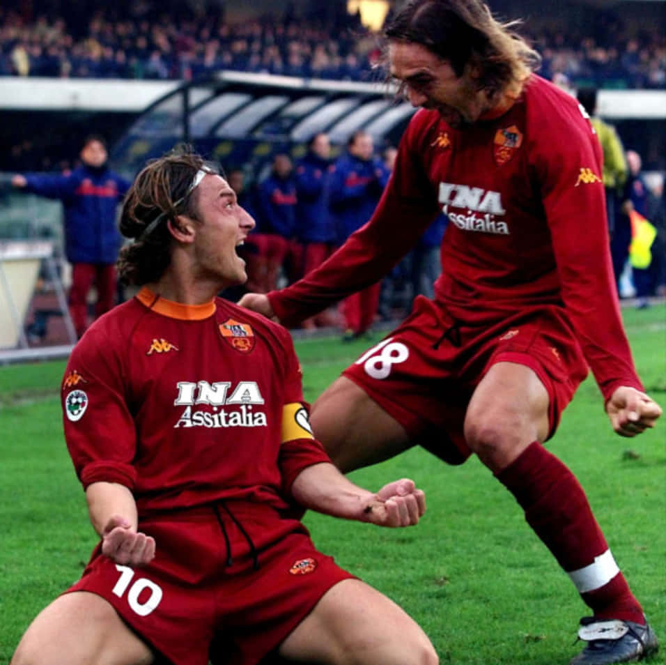 Gabriel Batistuta And Francesco Totti Celebrating Background
