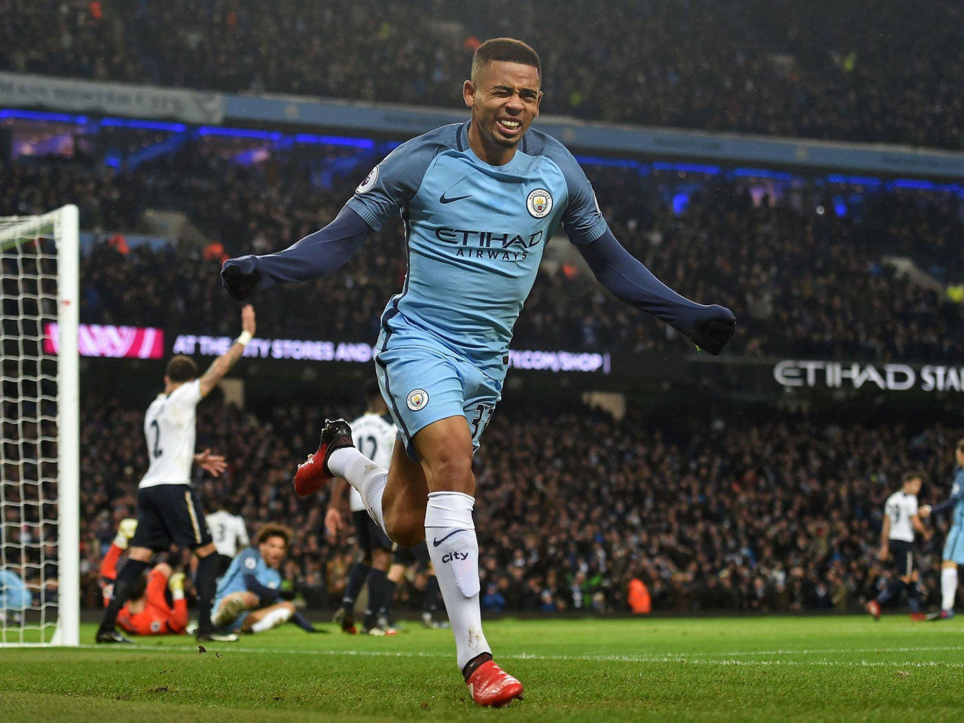 Gabriel Jesus In Blue Arms Out Background