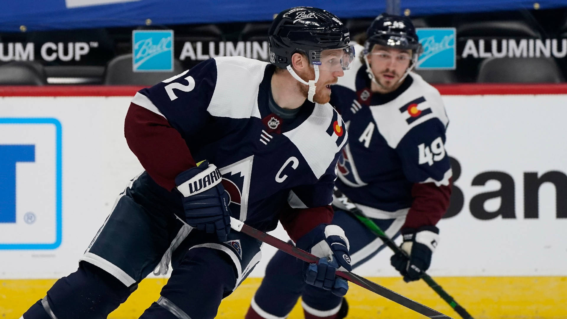 Gabriel Landeskog And Sam Girard In Action Background