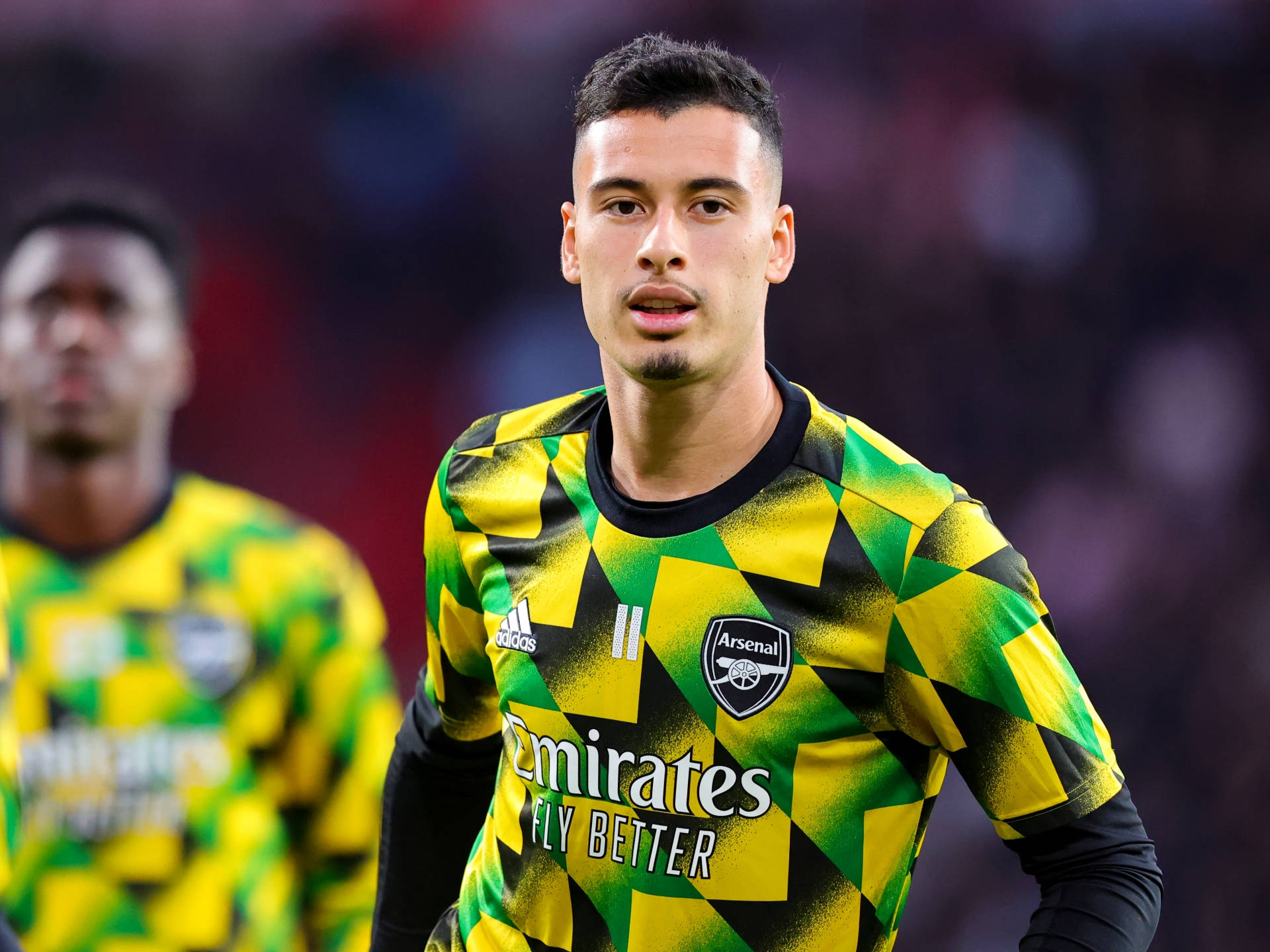 Gabriel Martinelli Yellow Green Arsenal Jersey Background