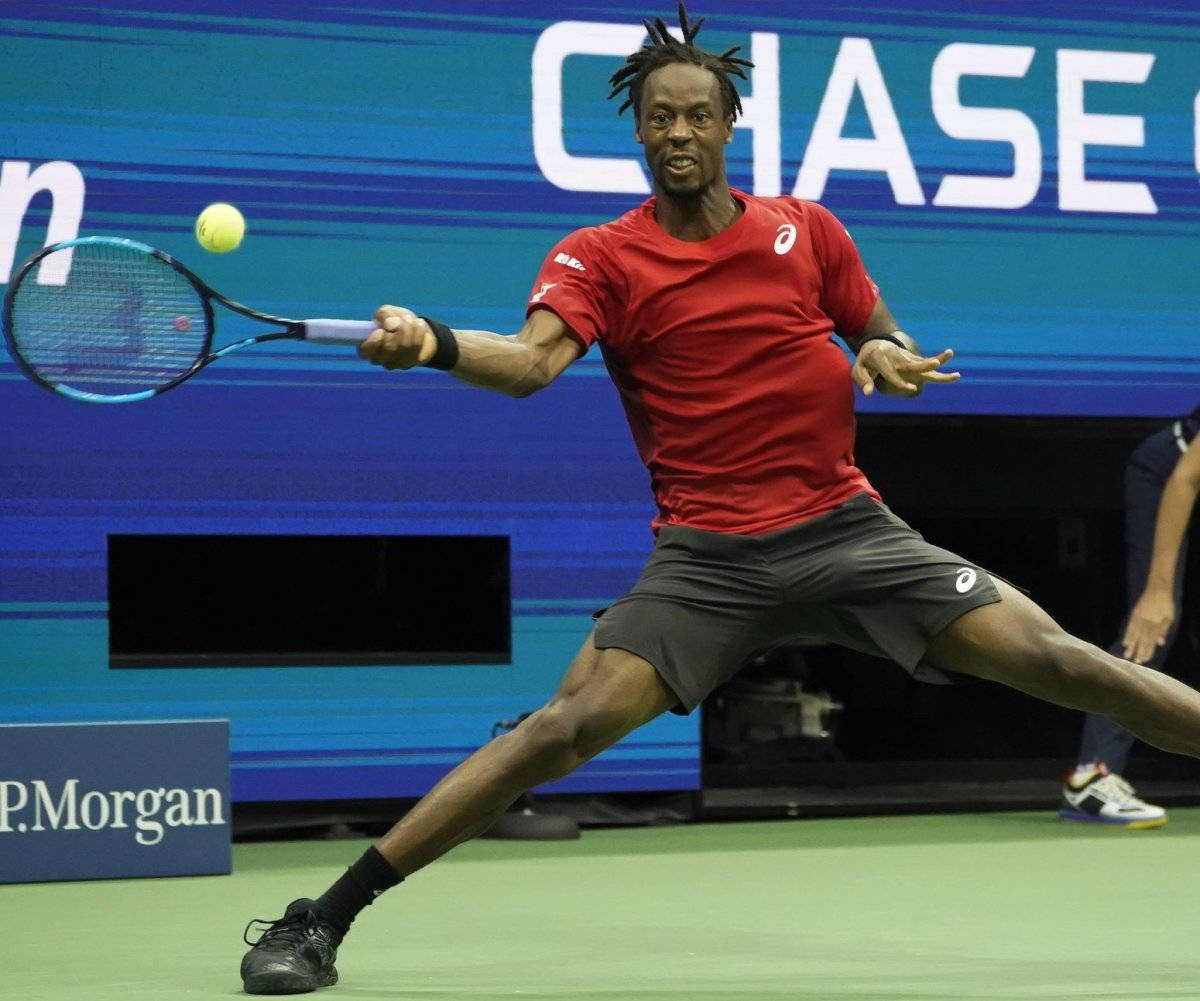 Gael Monfils Demonstrating His Agility On The Tennis Court Background