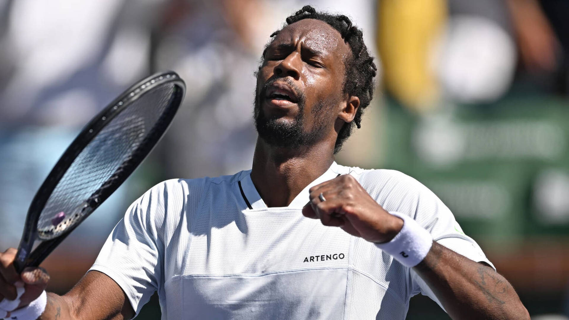 Gael Monfils Elegantly Dressed In A White Shirt Background