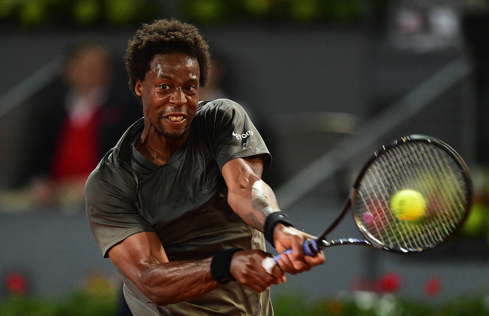 Gael Monfils Hitting Tennis Ball Background