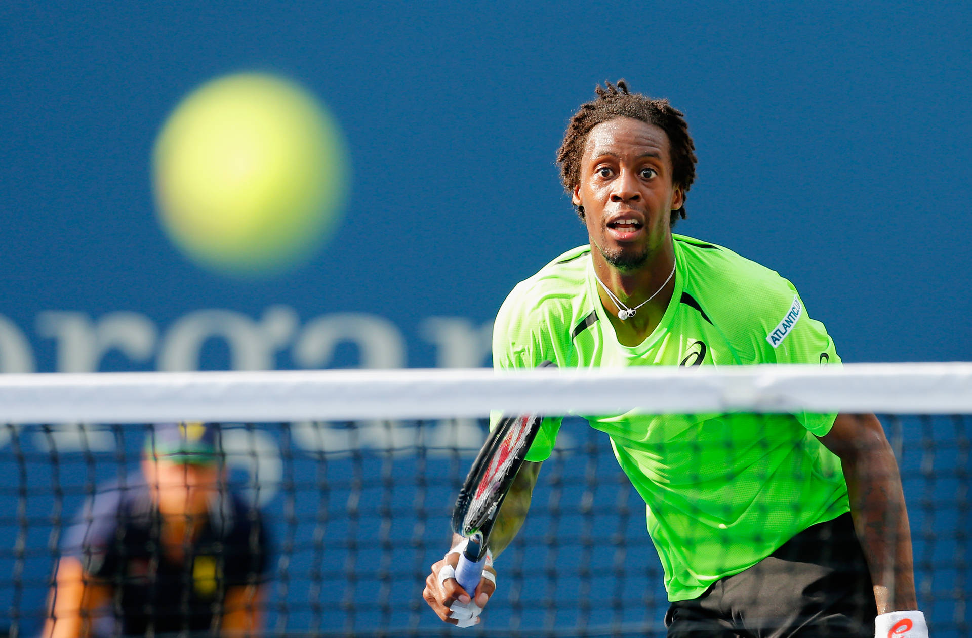 Gael Monfils In Action At A Professional Tennis Match Background