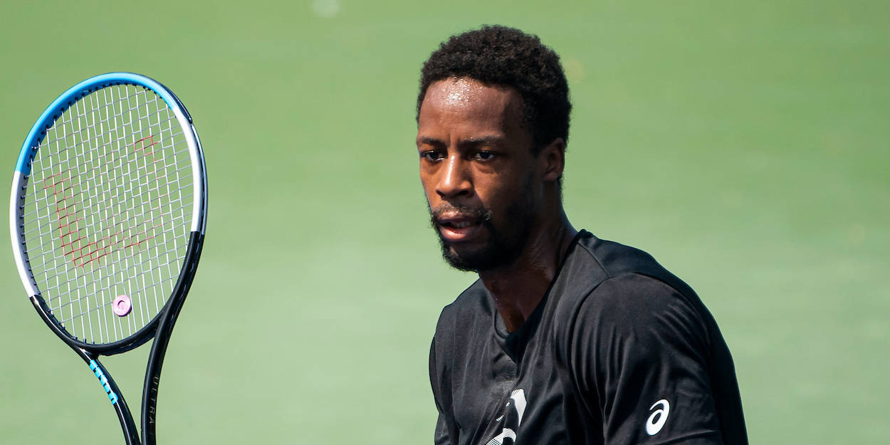 Gael Monfils On Green Tennis Court Background