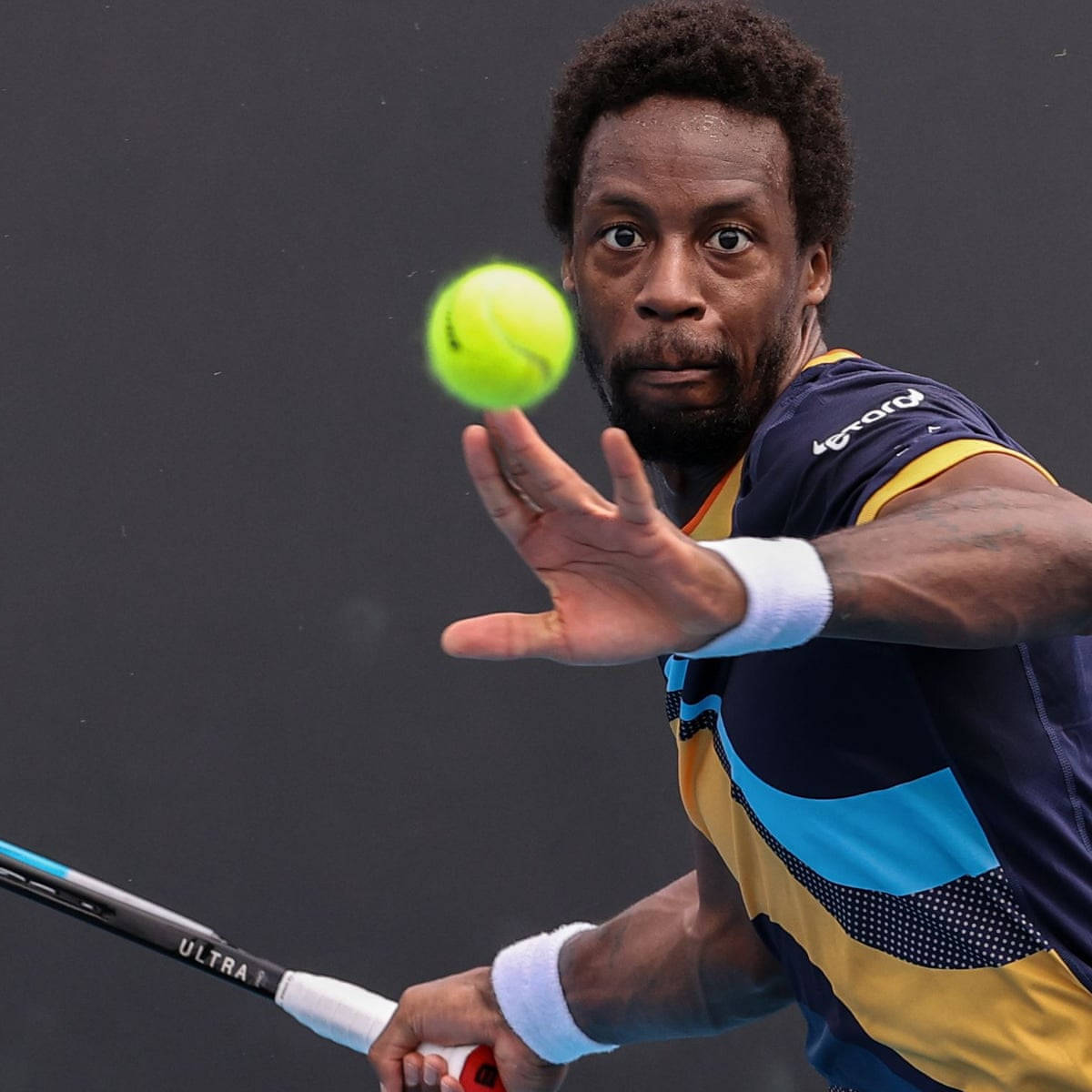 Gael Monfils Receiving Tennis Ball Background