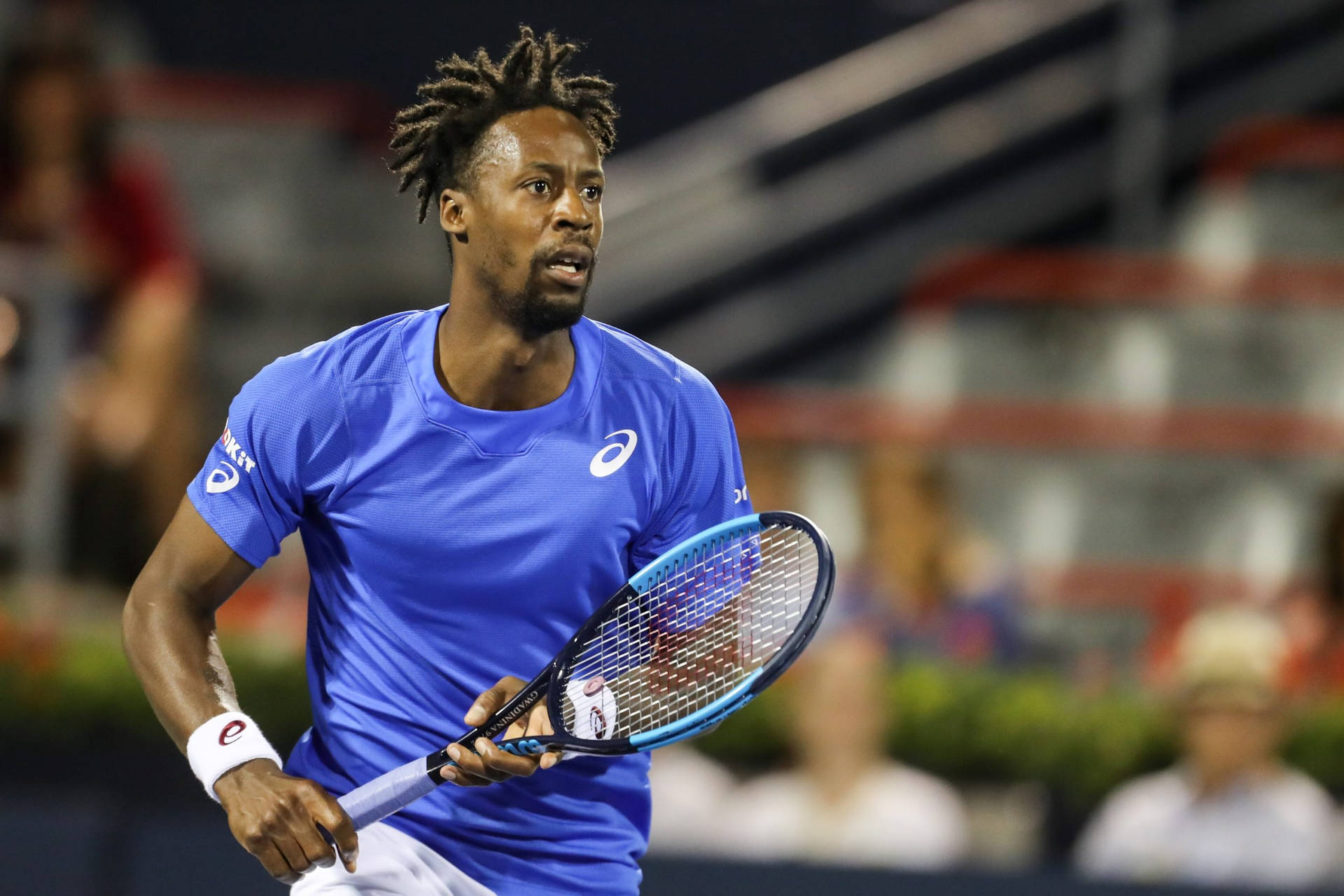 Gael Monfils Running In Blue Shirt Background