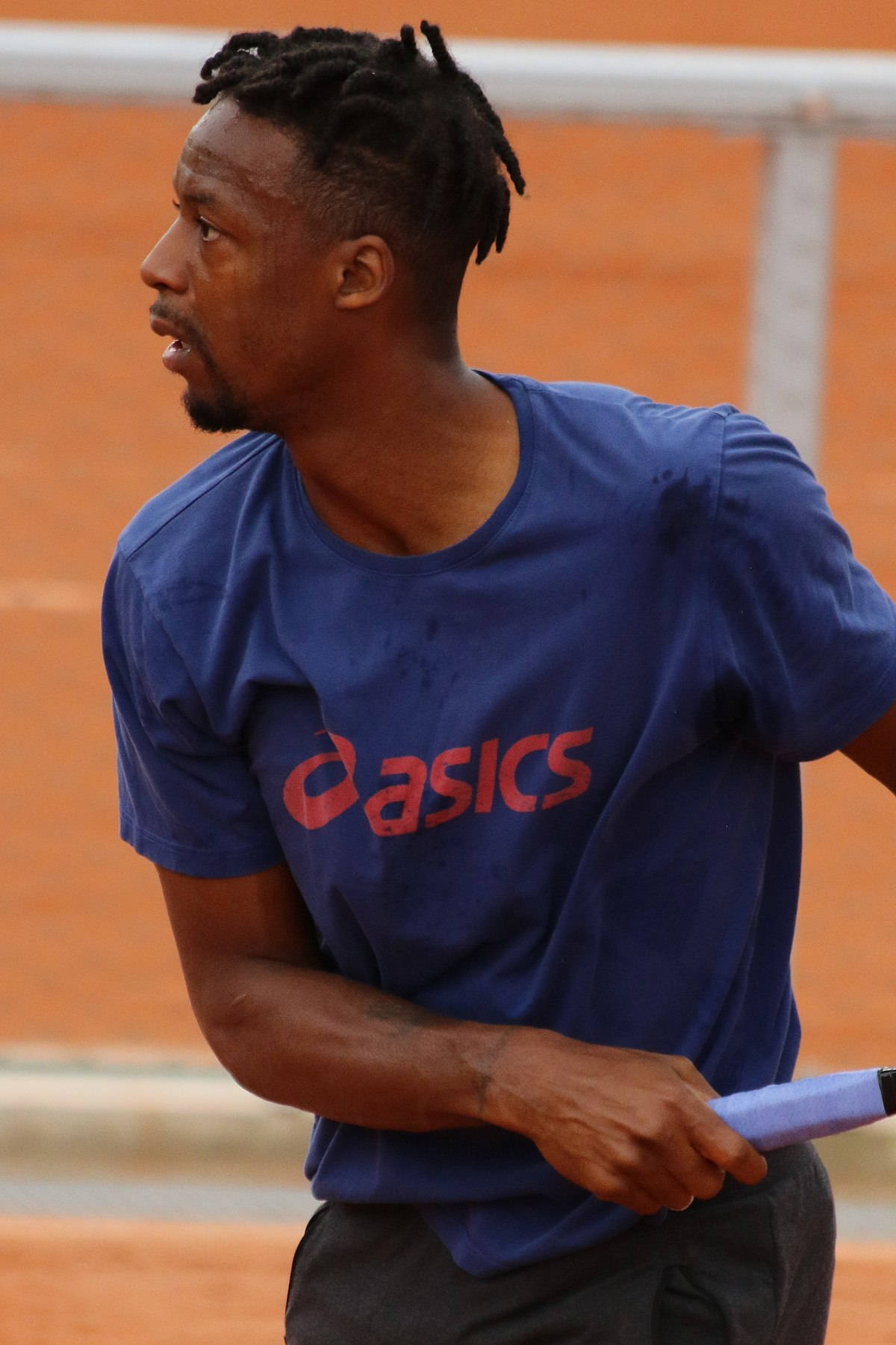 Gael Monfils Wearing Blue Asics Shirt Background