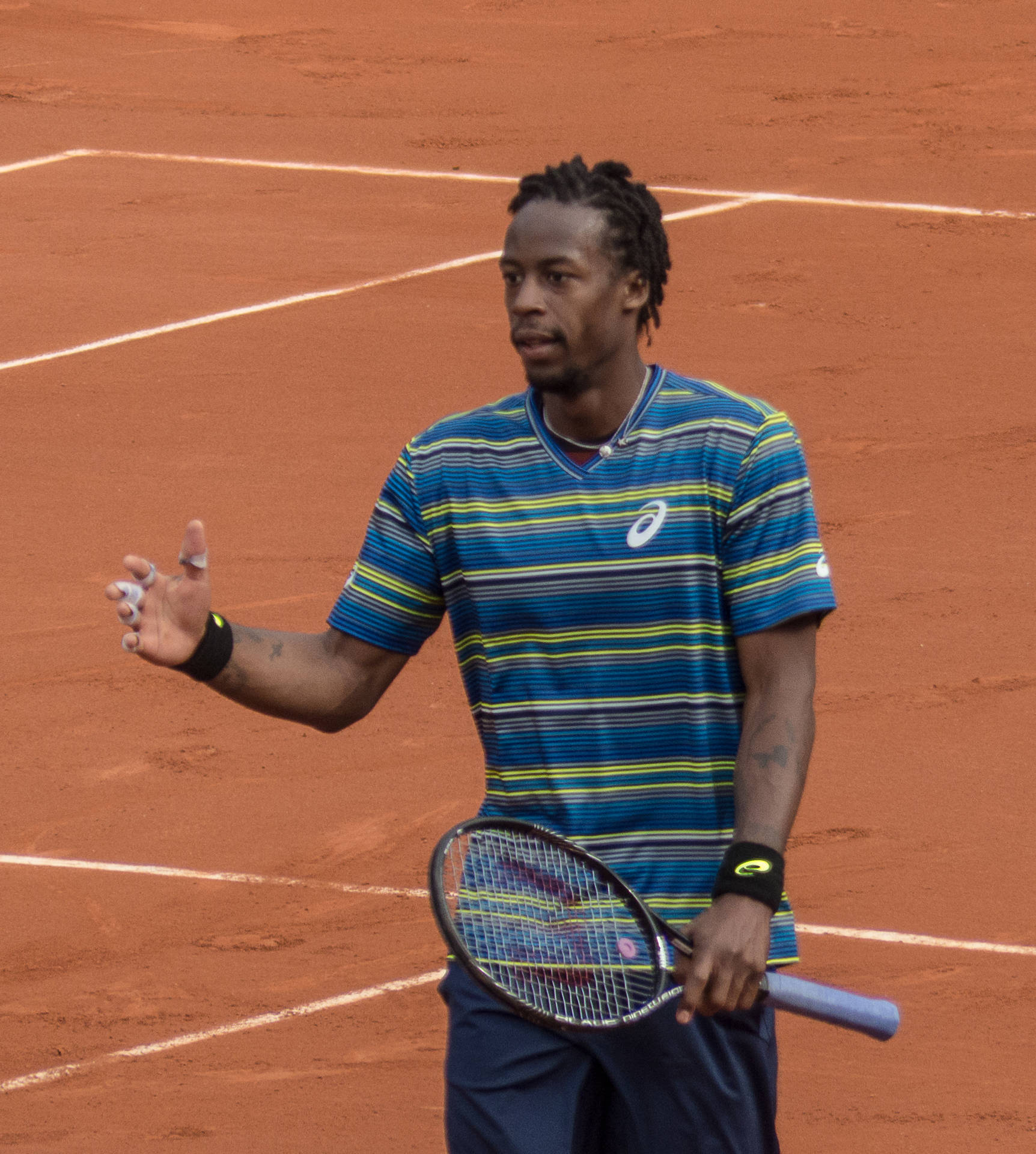 Gael Monfils Wearing Striped Shirt Background