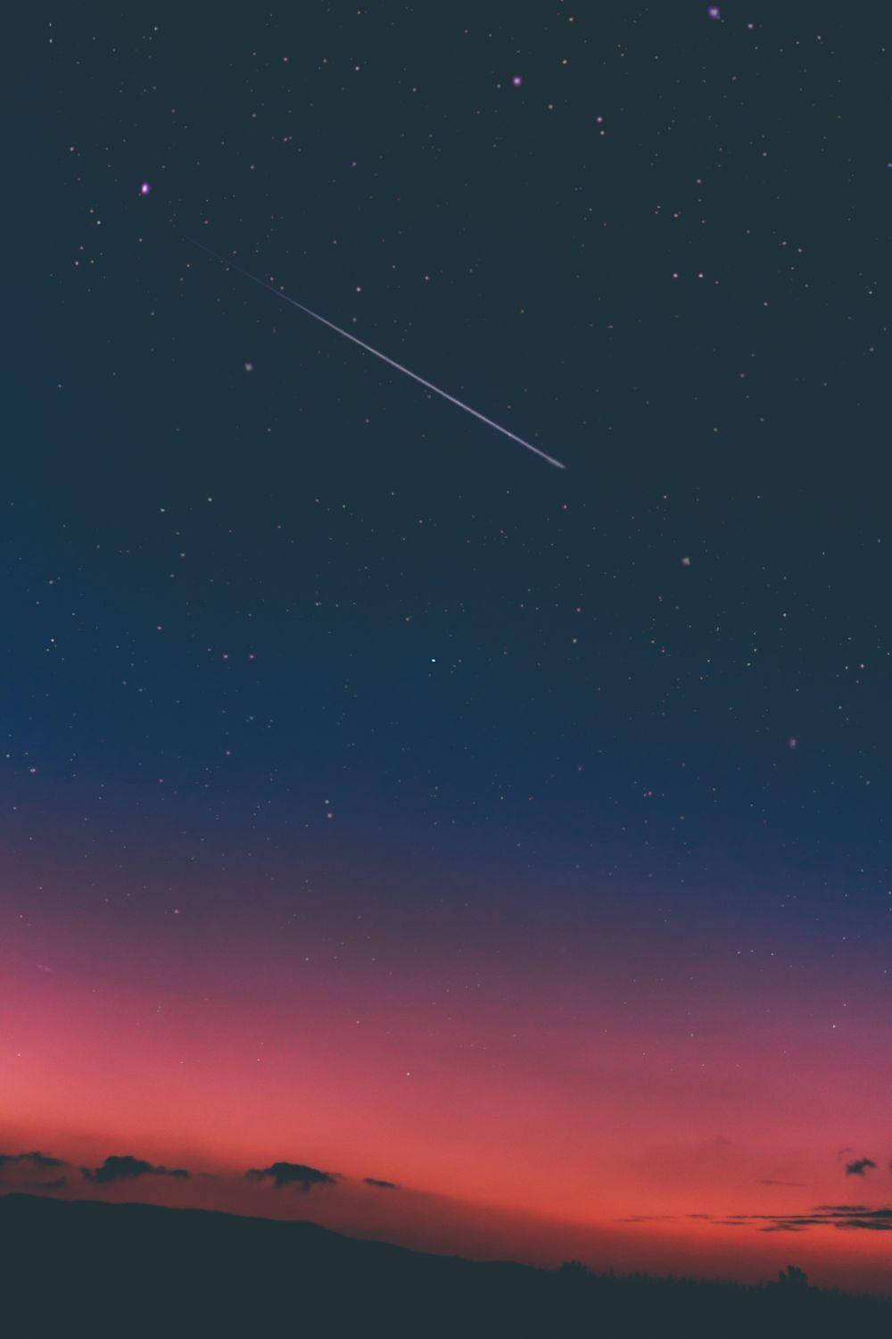Gambar Shooting Star In Sky Background