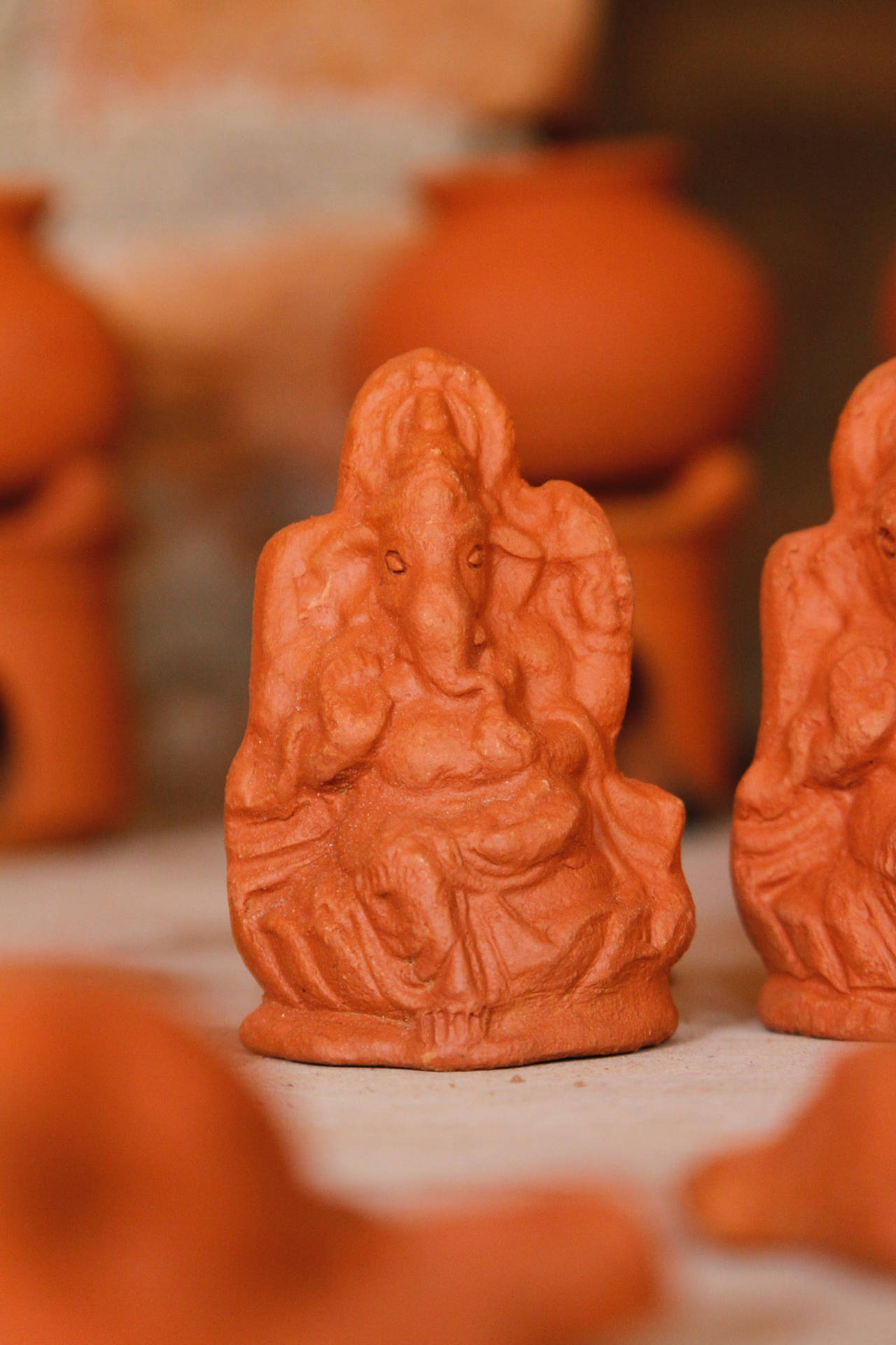 Ganesha On Throne Clay Figure Background