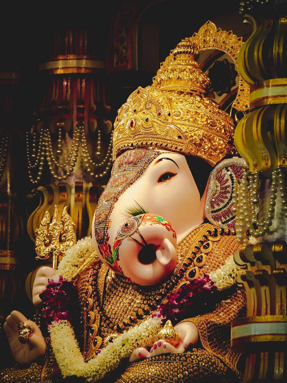 Ganpati Hd In Gold Attire Background